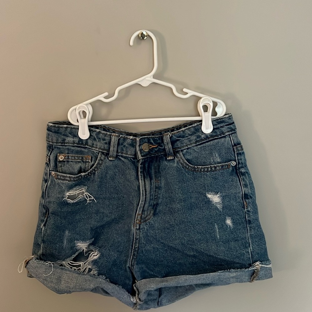 medium wash mid rise distressed jean shorts